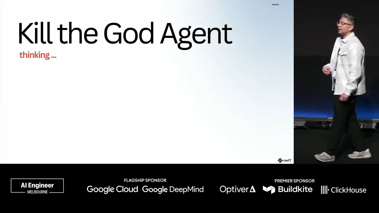 Adesh Gairola on stage at AI Engineer Melbourne, the title slide beside him reading 'Kill the God Agent, thinking ...'